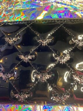 Black Patent Quilted Wristlet Clutch with Silver Bat Accents